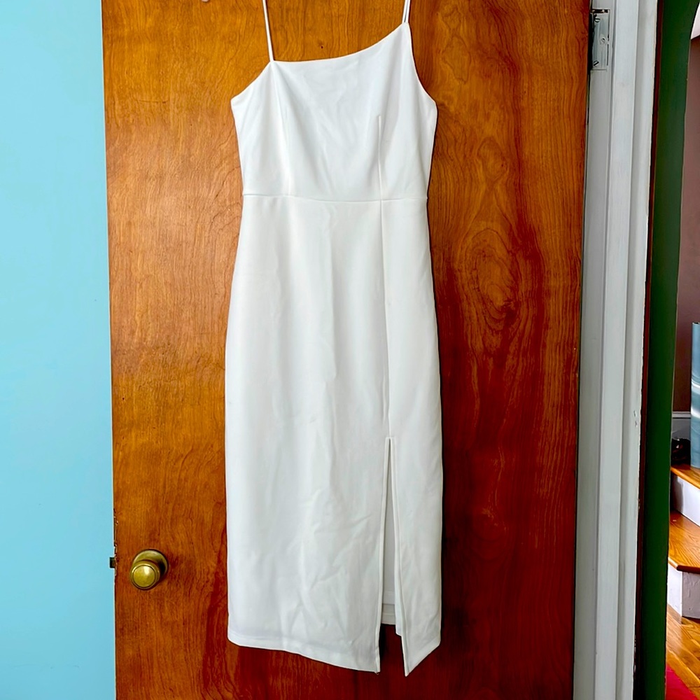 White Hello Molly dress with an asymmetrical neckline, and side slit.